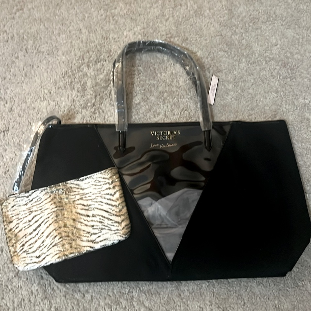 Stunning black VS carry on and leopard makeup bag!
